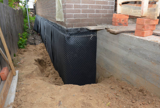 Happy homeowners after waterproofing job in Primm Springs